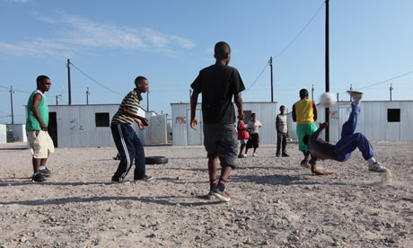 Children Playing Football In Africa