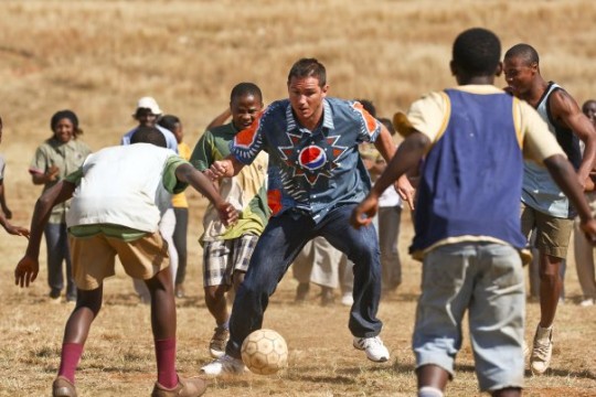 Children Playing Football In Africa